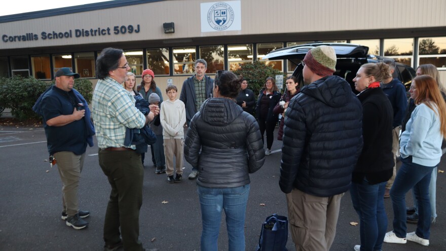 Parents gather outside ahead of the October 30, 2025 Corvallis School Board meeting.