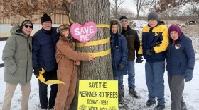Werkner Road residents coming together in front of an old-growth tree in the area.