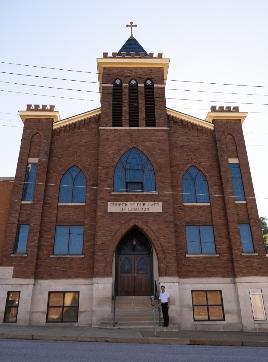 Dalton Hass in front of Our Lady of Lebanon in downtown Wheeling.
