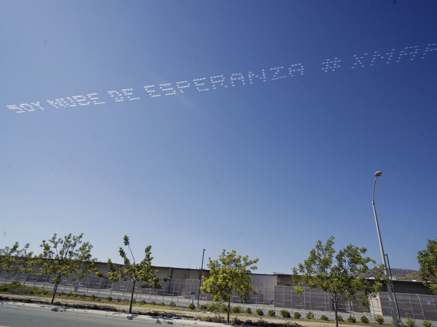 The artist Marcos Erre Ramírez had the words "Soy Nube De Esperanza," or "I Am A Cloud Of Hope," flown over the Otay Mesa Detention Center in San Diego near the U.S. border with Mexico.