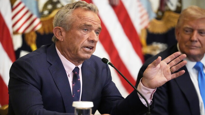 Health and Human Services Secretary Robert F. Kennedy Jr. speaks as President Donald Trump listens at an event to promote his proposal to improve Americans' access to their medical records in the East Room of the White House, Wednesday, July 30, 2025, in Washington. (AP Photo/Mark Schiefelbein)