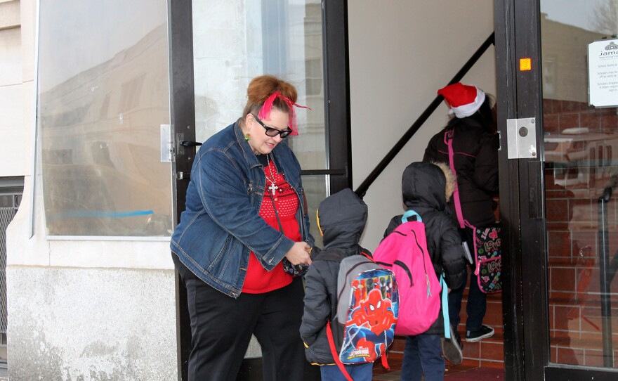 Special Education teacher Mary Tovar greets students entering Jamaa Learning Center on Thurs. Dec. 17, 2015.