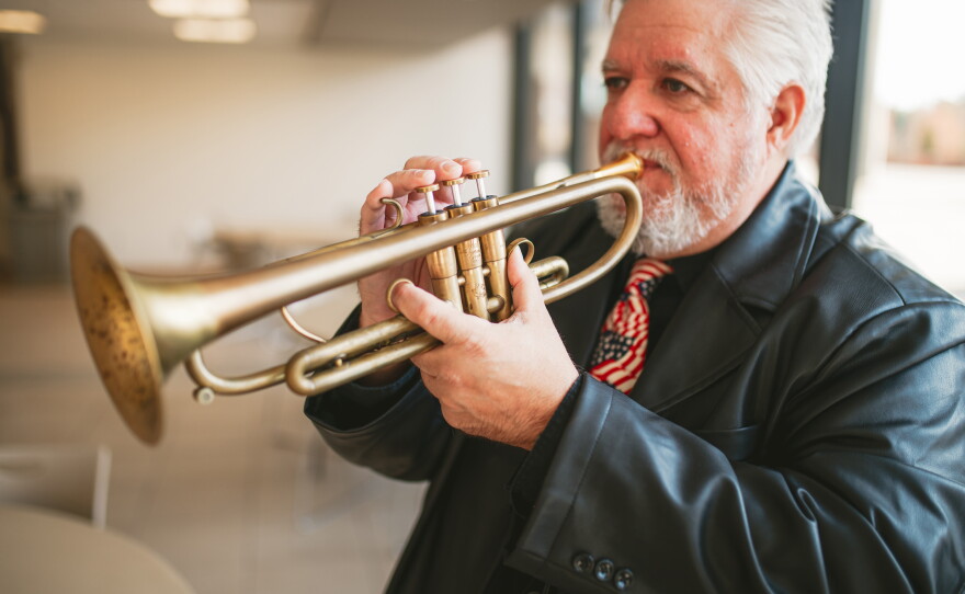 Leo Lavallee tunes up before playing taps during the Veterans Day ceremony at Naugatuck Valley Community College.