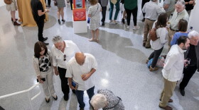 People attending an art exhibition at the Cultural Council for Palm Beach County