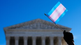 Protesters wave transgender pride flags outside the Supreme Court 