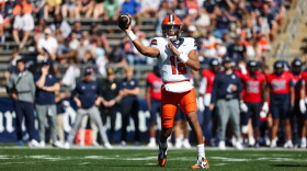 Amari Odom (12, White) attempts a pass against Connecticut.