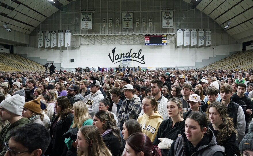 People attending a vigil for the four University of Idaho students who were killed on Nov. 13, 2022, stand in the Kibbie Dome as family members talk about their loved ones, Wednesday, Nov. 30, 2022, in Moscow, Idaho. (AP Photo/Ted S. Warren)