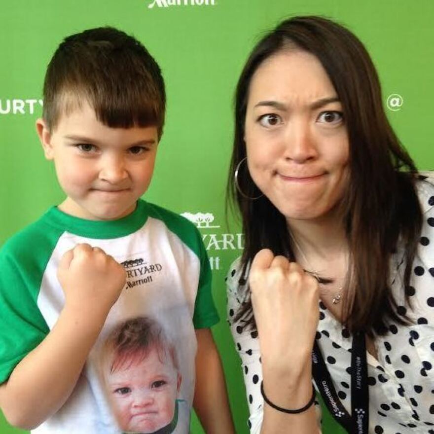 Internet meme "Success Kid" was once a baby (as seen on his shirt), but now he's all grown up. Elise Hu mirrors the pose.