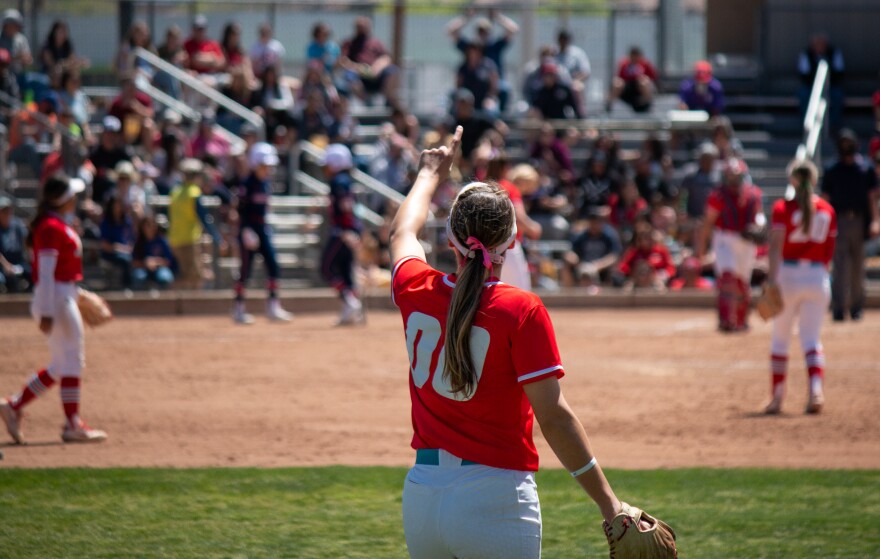 Center fielder Andrea Howard (#00) lifts up a No. 1 with her fingers after pitcher Emma Guindon gets a strikeout during the last game of the series against Fresno State on Saturday, April 16 at the Lobo Softball Field.
