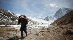 Sherpa carrying kit to base camp on Mount Everest. Photo credit: BBC