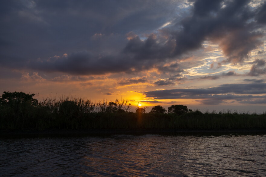 The sun sets over the coastal Louisiana marsh near Pecan Island on Tuesday, August 25, 2026.