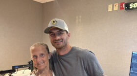 Former Lincoln Avenue School teacher Amy Domagowski and alumnus Todd Gross are smiling for a picture.