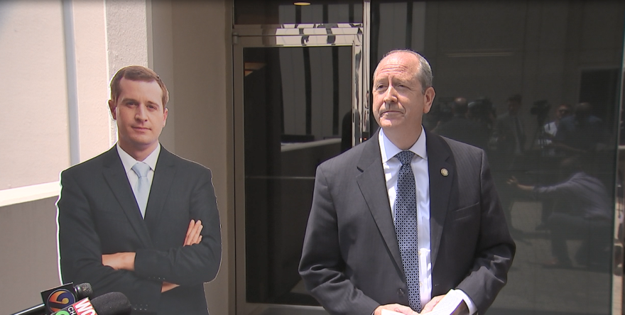 Dan Bishop holds a news conference in front of opponent Dan McCready's office. 
