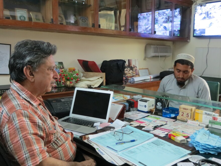 Dr. Khalid Mufti (left) speaks with Noor Khan, who is being treated for PTSD. Khan is a farmer in rural, northwestern Pakistan, where heavy fighting in recent years has caused many anxiety-related disorders among civilians.