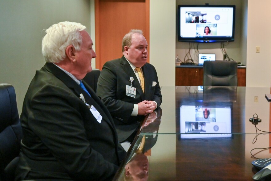 Commonwealth Health CEO Michael Clark (left) and vice president of clinical services and quality at Commonwealth Health Patrick Conaboy are joined by Tenor Health Foundation CEO Radha Savitala on video to discuss the last three month's of Tenor's leadership of three area hospitals.