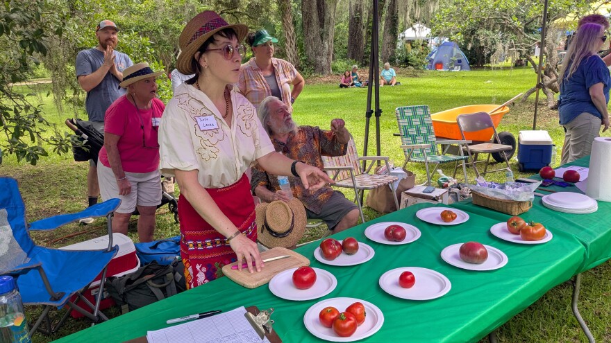 One of last year's Feastival Judges, Laura Nicole Floyd, samples the various entrees for the most delicious tomato competition.