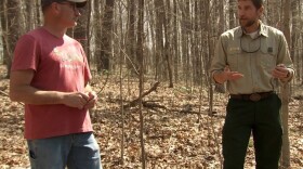 Hoosier National Forest Supervisor Mike Chaveas (right) talks with a southern Indiana resident during an info session on the Buffalo Springs Restoration Project in 2022.
