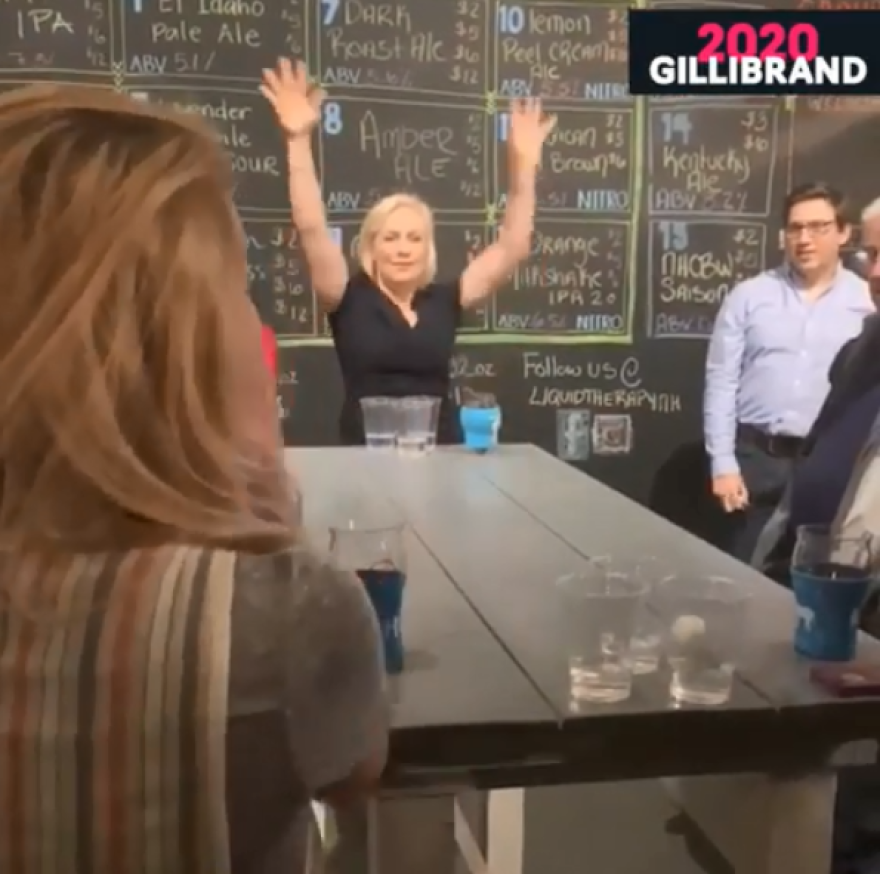 Kirsten Gillibrand, D-N.Y., plays a game of beer pong at Liquid Therapy in Nashua.