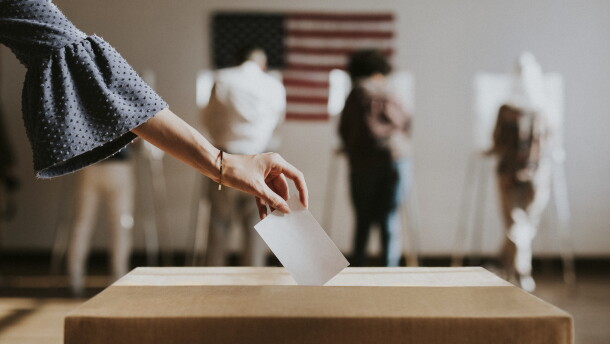 Casting her vote at a ballot box