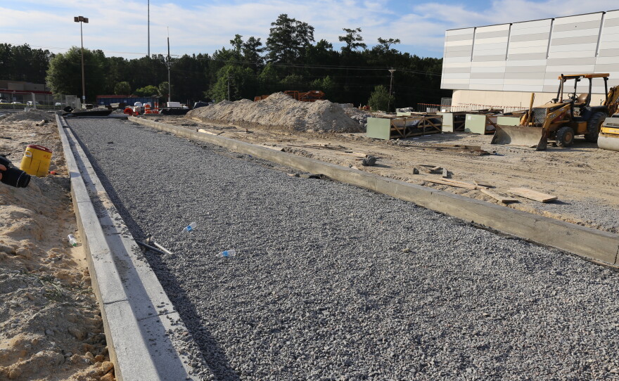 Crews lay down pervious pavement at the new Richland County Magistrate. Unlike its impermeable counterpart, this type of concrete lets water pass through it instead of rest on top.  