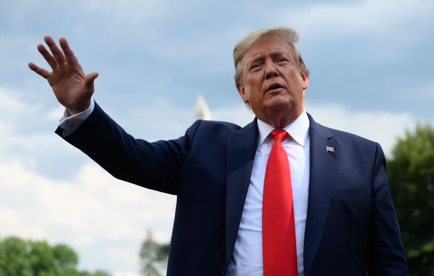 President Trump speaks to reporters on the South Lawn of the White House on Wednesday after Robert Mueller's testimony, which he dismissed as a failure for Democrats.