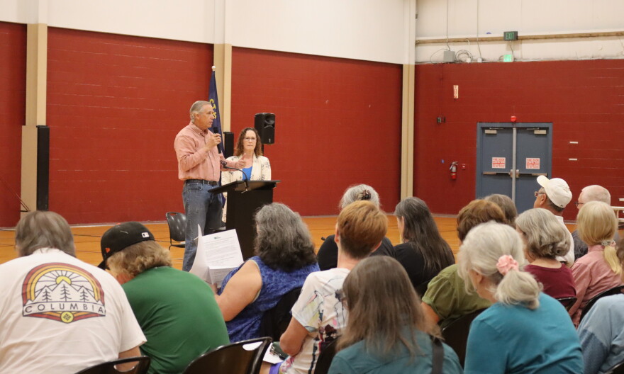 Jeff Merkley, left, and Val Hoyle, right, speak to a crowd on Sept. 10, 2026 during a "Stop the Corruption" town hall at the Bob Keefer Center in Springfield.