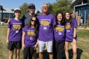 Picture of several people in purple Alzheimer's Association shirts at Heartland Community College event