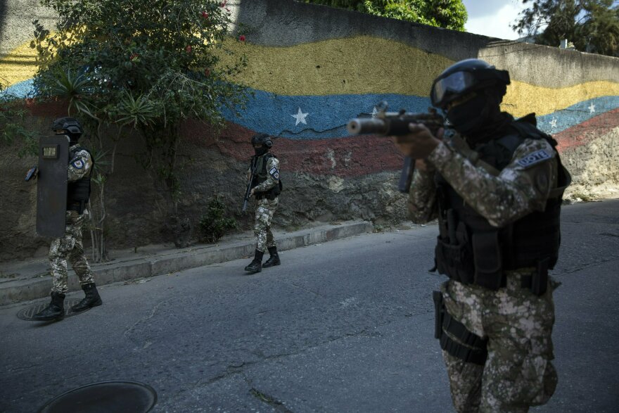 Members of the now disbanded National Police Special Action Force, or FAES, patrol the Antimano neighborhood of Caracas, Venezuela, on Jan. 29, 2019.