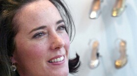 In this May 13, 2004 file photo, designer Kate Spade poses with shoes from her next collection in New York. Law enforcement officials say Tuesday, June 5, 2018, that New York fashion designer Kate Spade has been found dead in her apartment in an apparent suicide. (Bebeto Matthews/AP)