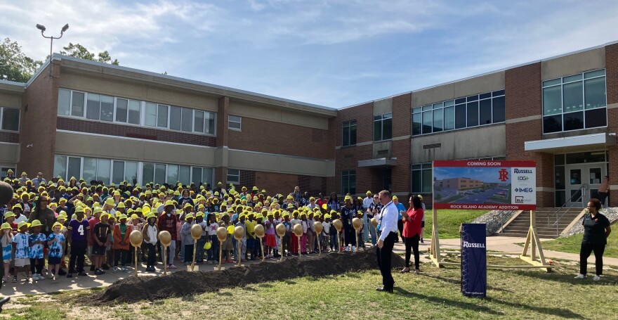 Rock Island Academy principal Thomas Ryan helps organize the 500-plus students before the groundbreaking for a two-story, 12,880-square-foot addition on Thursday, May 28, 2026.