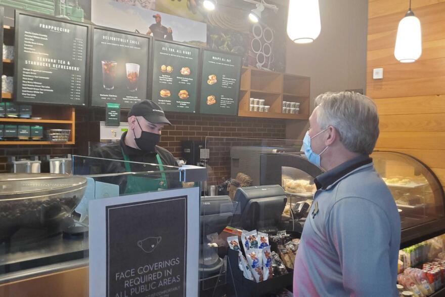 Michael Moros, Indianapolis Marriott Downtown general manager, gets a coffee from the hotel's Starbucks.