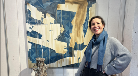 Laguna artist Marla Allison beside her painting.