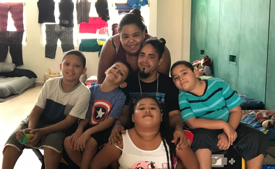 Chaylin Palma, her husband Miguel Nieves and their four children, (left to right) Johushua, Abimael, Chalyani and Miguel have been living in a shelter in a high school since their home was destroyed in Hurricane Maria.