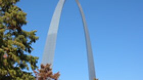 The Gateway Arch could represent westward expansion away from the city.