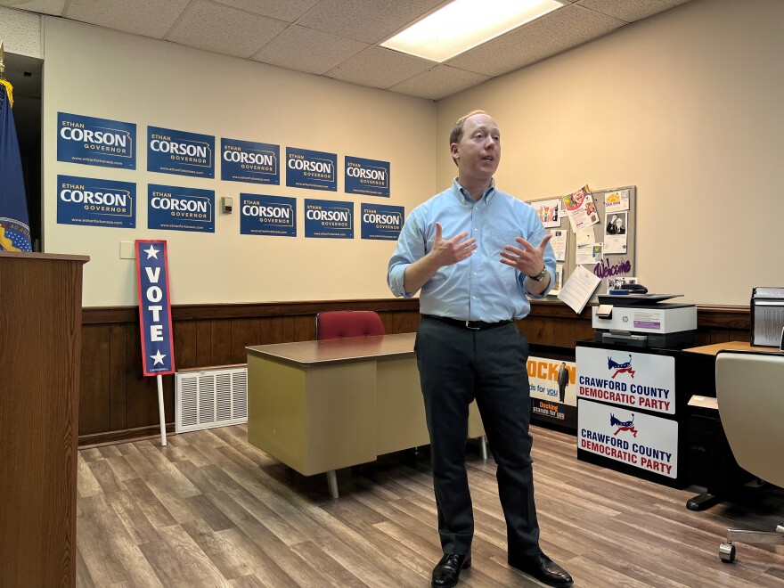Ethan Corson speaks in the Crawford County Democrats' office. He's standing in front of a wall, which has his campaign signs on it.
