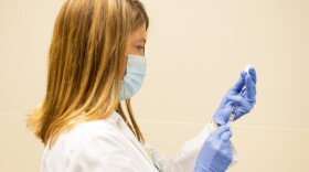 St. Elizabeth pharmacy supervisor Suzi Francis isn't eligible to get the COVID vaccine yet and is now giving it to hundreds of high-risk heathcare workers at her hospital.