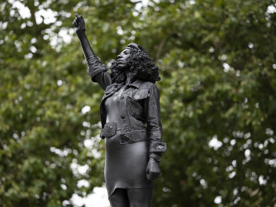 A new sculpture by local artist Marc Quinn, depicting Black Lives Matter protester Jen Reid, stands on the plinth where the Edward Colston statue used to rest in Bristol.