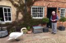 Composer John Rutter and one of his friendly neighborhood geese have a chat