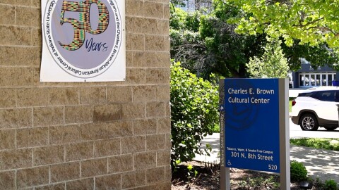 A blue sign at Indiana State University says "The Charles B. Cultural Center."