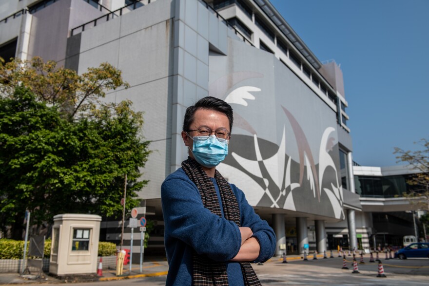 Dr. Alfred Wong stands in front of Tuen Mun Hospital in Hong Kong. He says the new coronavirus outbreak has placed incredible stress on health care workers.