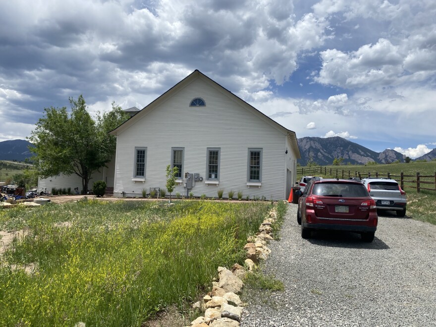 Neighbors gathered at the restored Marshall Schoolhouse on a recent Saturday as they have been doing monthly since the fire.