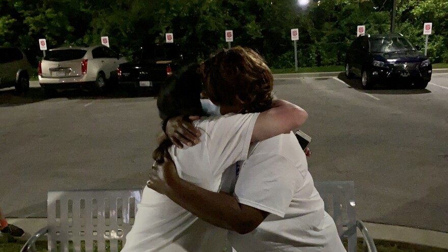 Jones embraces Heather Robinett at her victory party in Ferguson on June 3, 2020. Jones defeated Robinett to become Ferguson's mayor by about 100 votes.