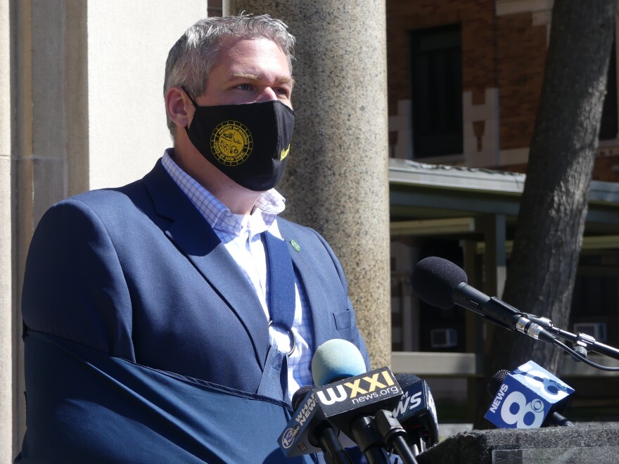 Monroe County Executive addresses the press outside the main entrance at Monroe Community Hospital in April 2021.