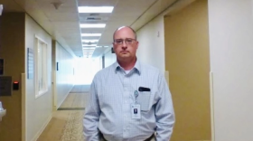 Dr. Jim McGovern stands in a hallway.