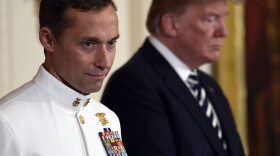 President Trump stands with retired Master Chief Special Warfare Operator Britt K. Slabinski during a ceremony to award him the Medal of Honor in the East Room of the White House. (Susan Walsh/AP)