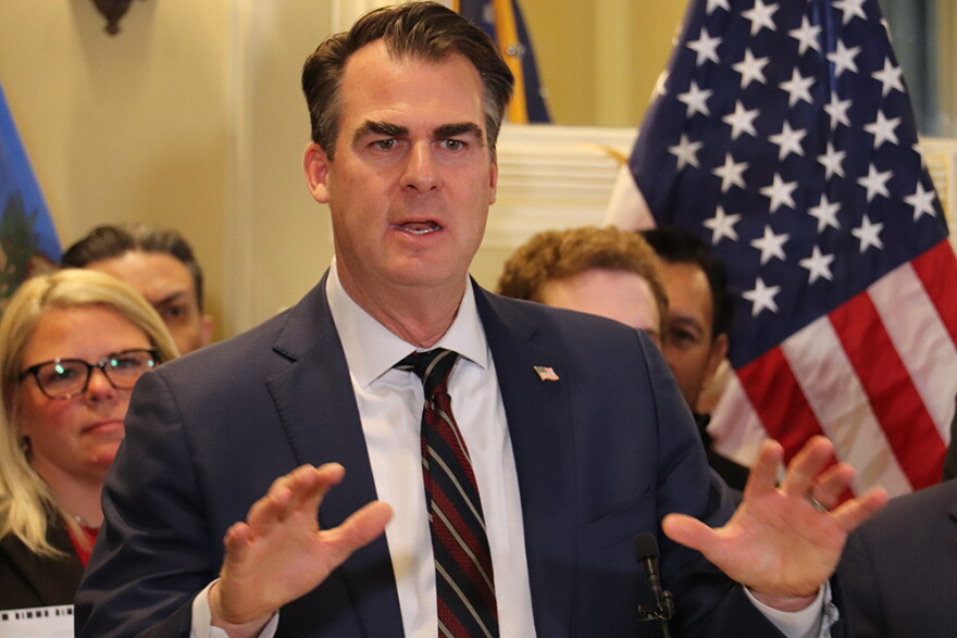 Oklahoma Governor Kevin Stitt speaks in support of a grocery tax cut at a bill signing ceremony Feb. 27, 2024, in a ceremonial room inside the Oklahoma State Capitol.