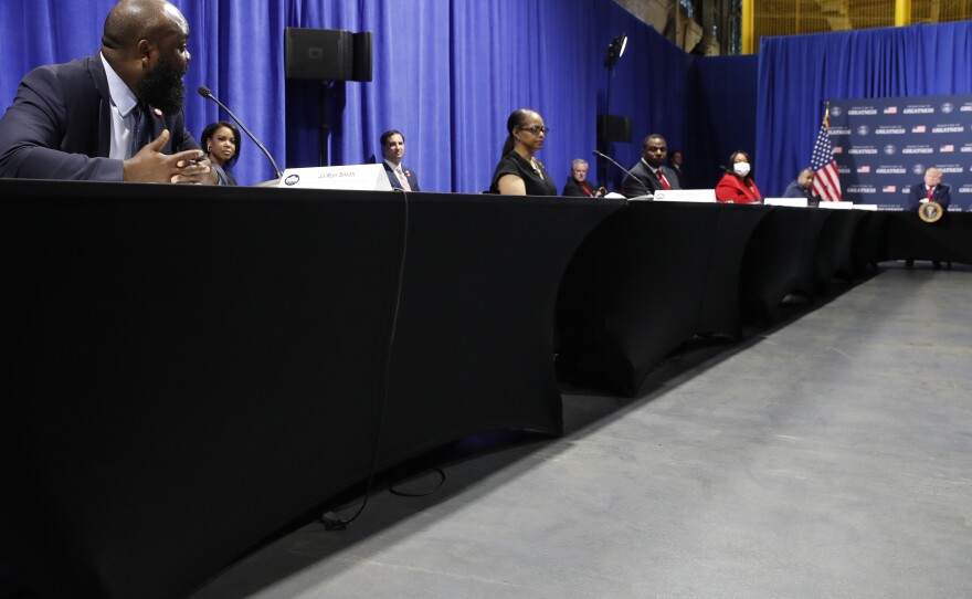 White House aide Ja'Ron Smith speaks during a meeting President Trump held with African American leaders in Michigan on Thursday.