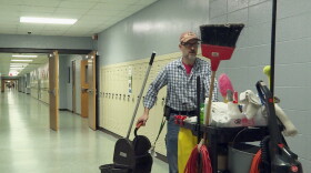 A member of Monrovia High School's custodial staff walks through a hallway during the school day.