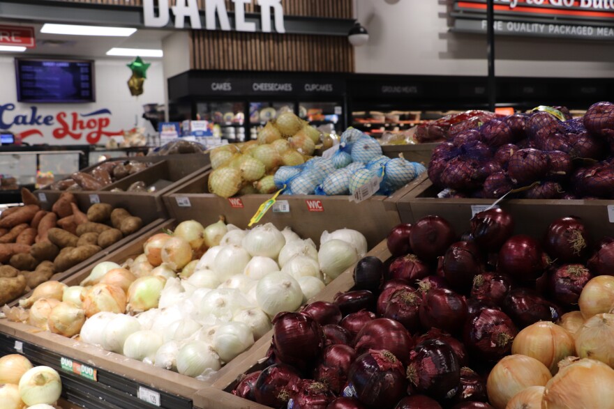 Onions and potatoes are put in piles on display for shoppers in an Oklahoma City grocery store.