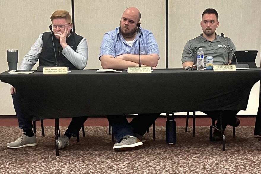 Washington City Council members (from left) Brandon Moss, Michael Ernst and Todd Sluder listen intently to a speaker Monday during a discussion about a proposed adult-use cannabis dispensary in Washington.